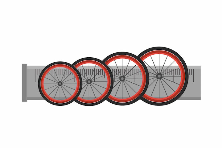 different bike tires with a giant ruler